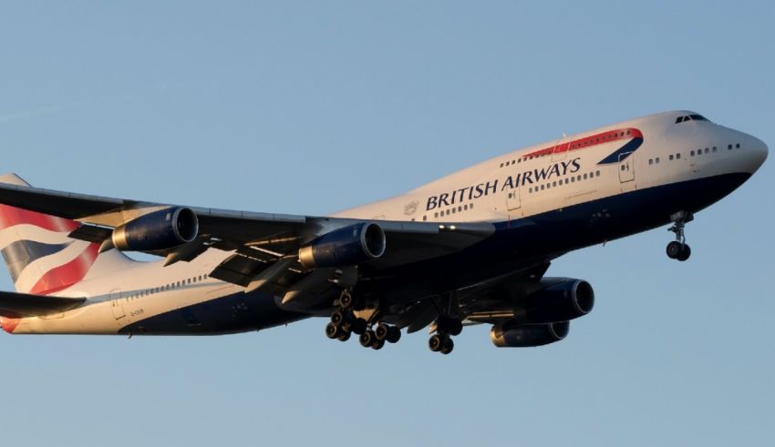 A british airways plane is flying through the sky.