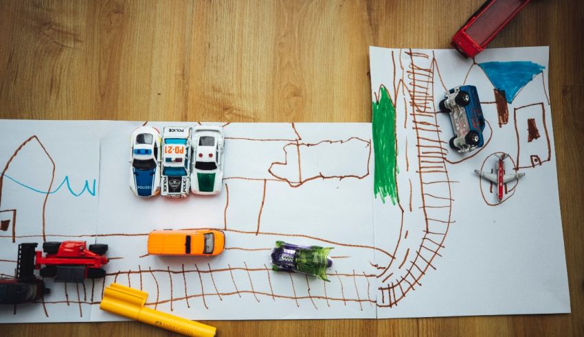 A child's drawing of a toy car on a piece of paper.