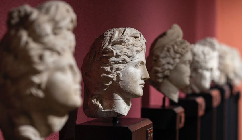 A row of marble busts on display in a museum.