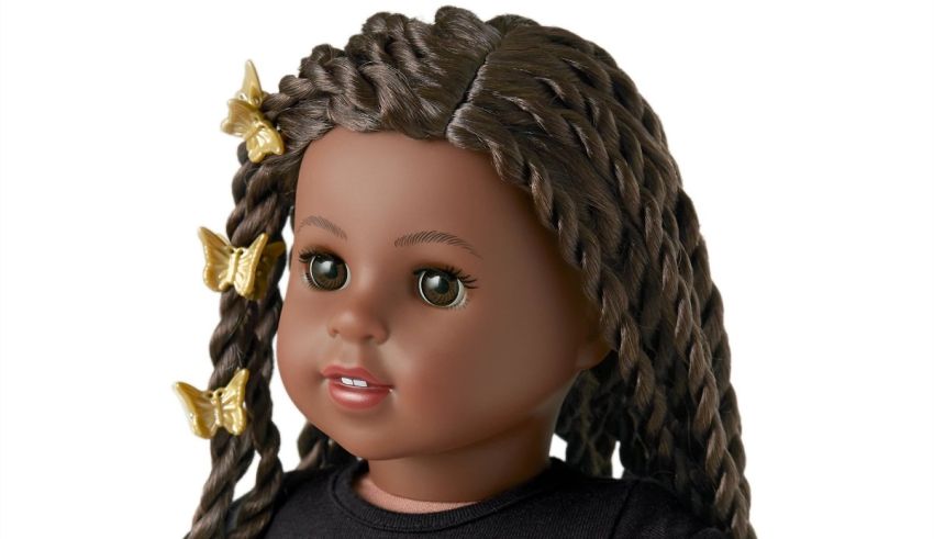 A black doll with braids and a black shirt.