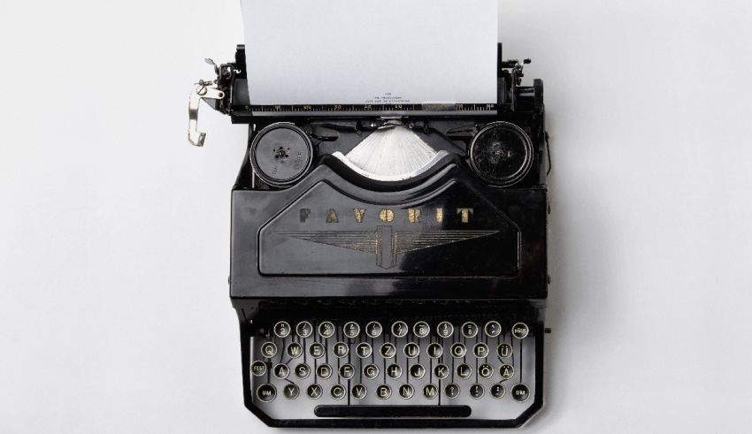 A black typewriter on a white background.