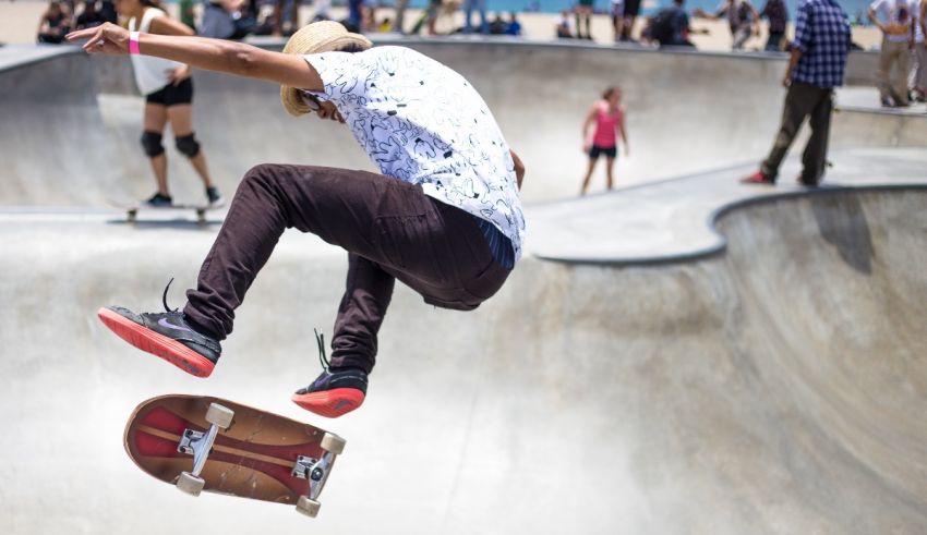 A man doing a trick on a skateboard at a skate park.