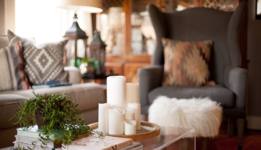 A living room with candles on a coffee table.