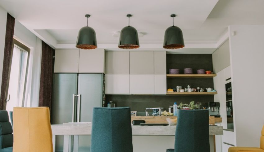 A kitchen with a table and chairs.