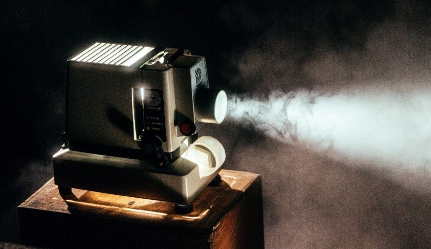 A projector with smoke coming out of it.