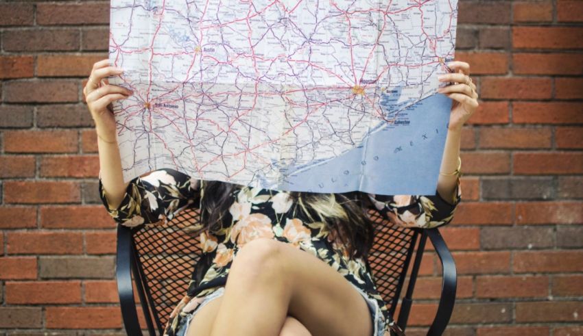 A woman sitting in a chair with a map in front of her.