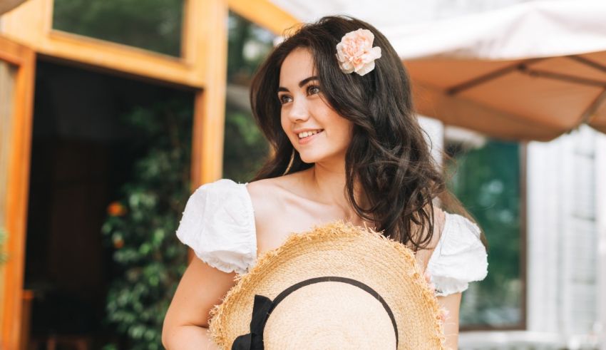 A young woman wearing a straw hat.