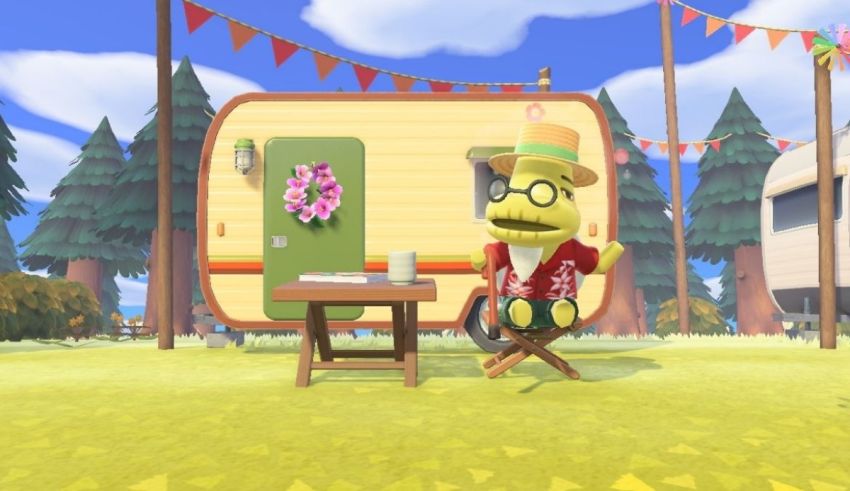 An animal crossing character sits at a table in front of a camper.