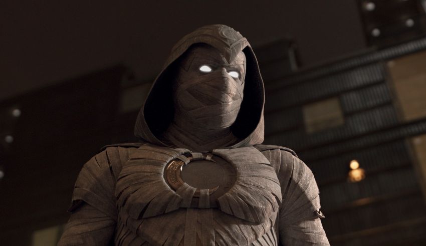 A man dressed in a mummy costume is standing in front of a city.