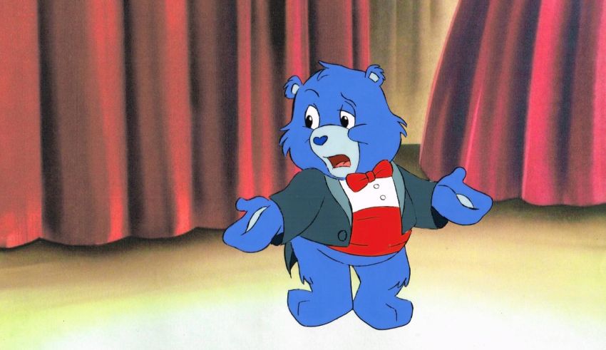 A cartoon bear in a tuxedo standing in front of a curtain.