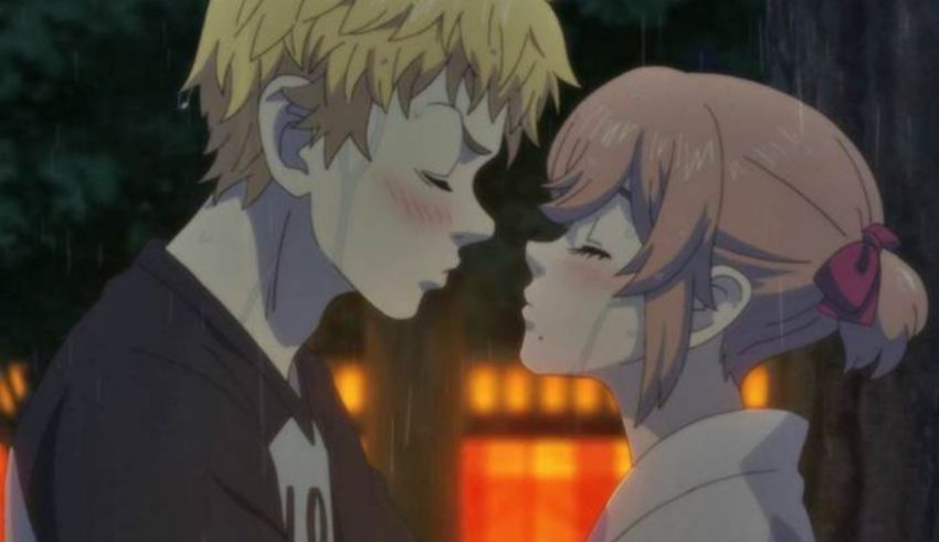 An anime couple kissing in the rain.