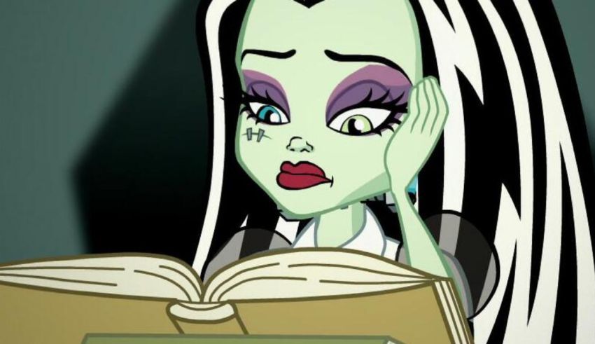A monster high character reading a book.
