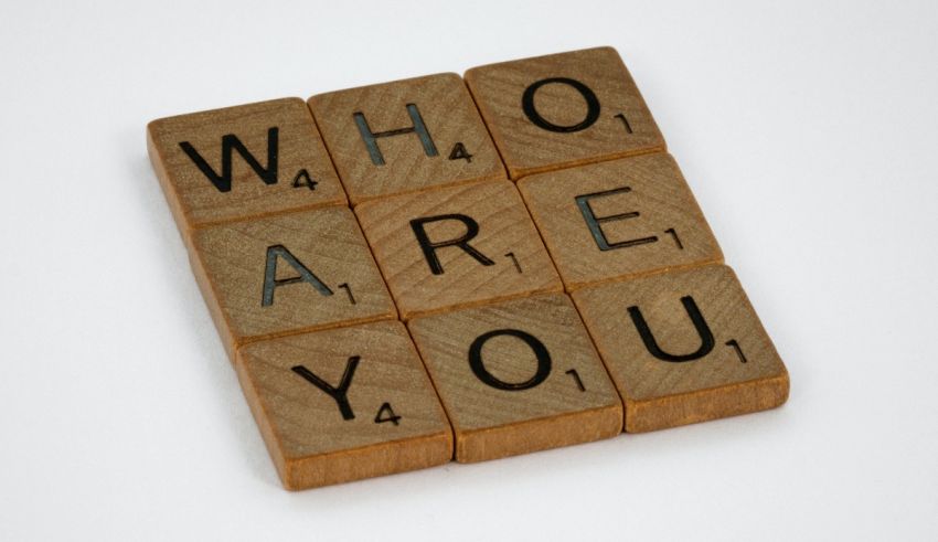 Who are you scrabble tiles on a white background.