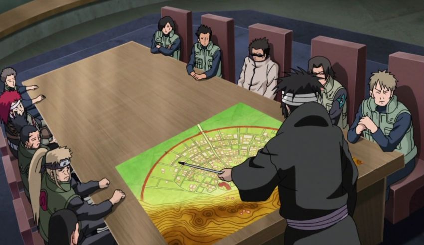 A group of people sitting around a table with a map.