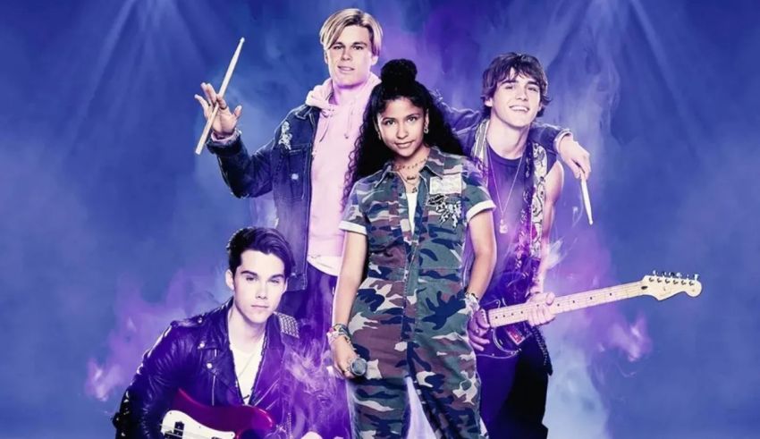 A group of people posing in front of a purple background.