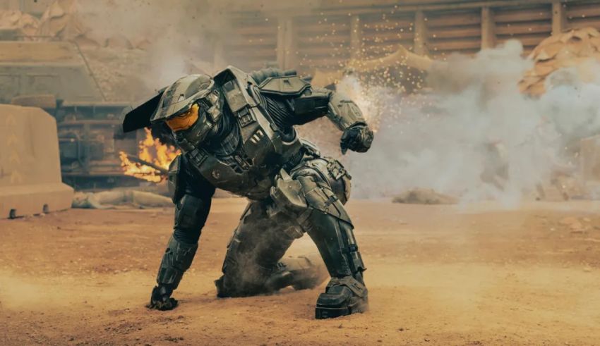 Halo master chief in the desert with smoke coming out of his helmet.