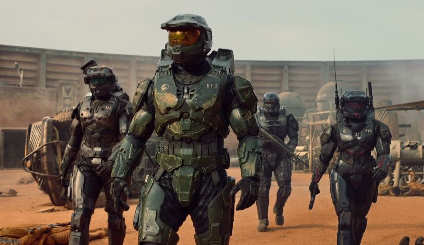 A group of halo characters standing in a desert.