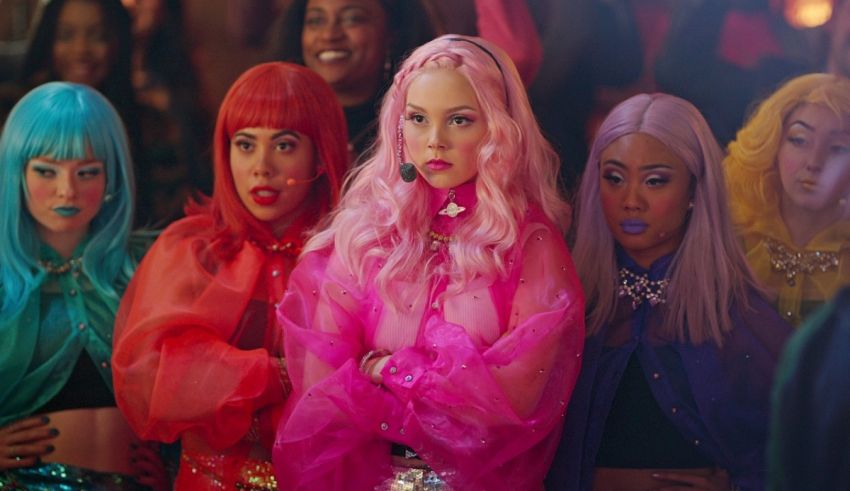 A group of women in colorful outfits standing next to each other.