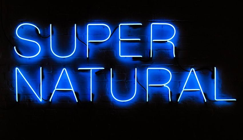 A blue neon sign with the words super natural on it.