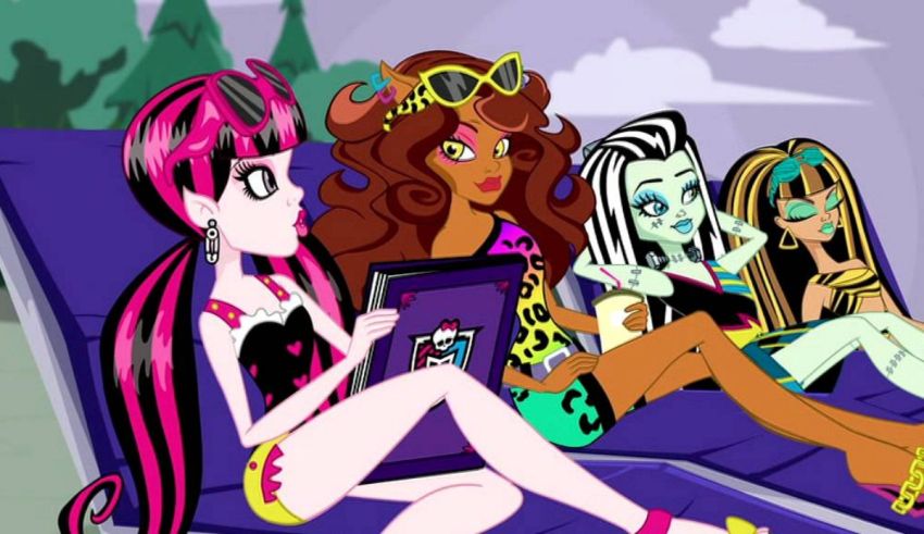 A group of monster high girls sitting on a couch.