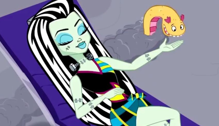 A monster high girl is sitting in a chair with a teddy bear.