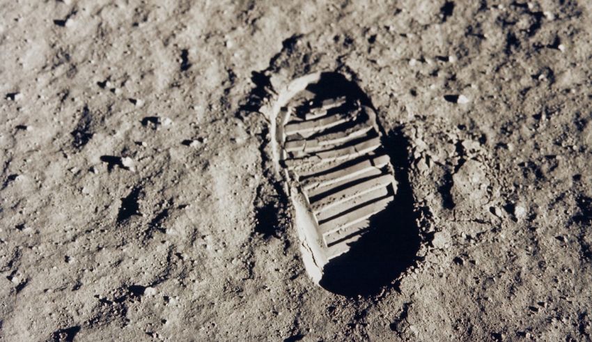 A footprint in the sand on the moon.
