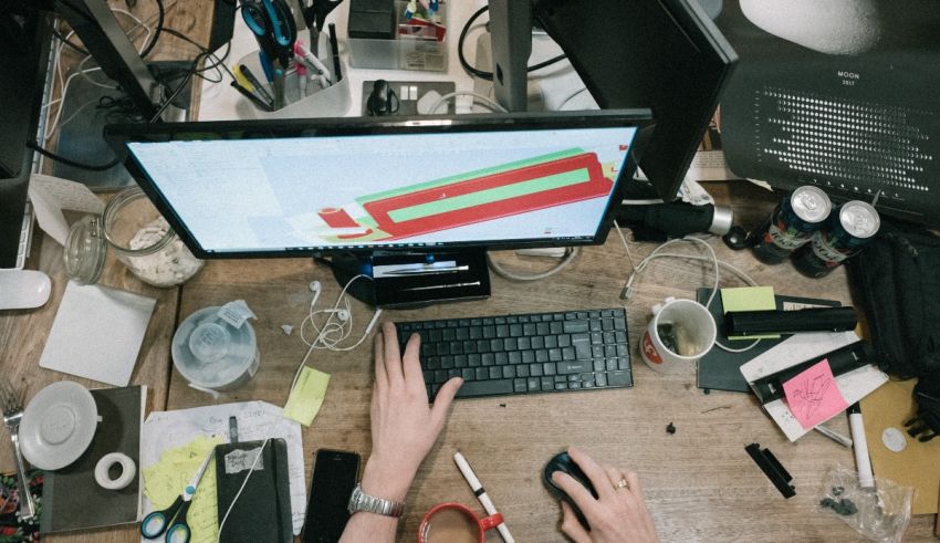 A person working at a desk with a computer.