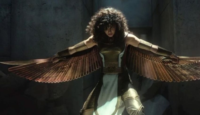 A woman in a golden costume with wings.