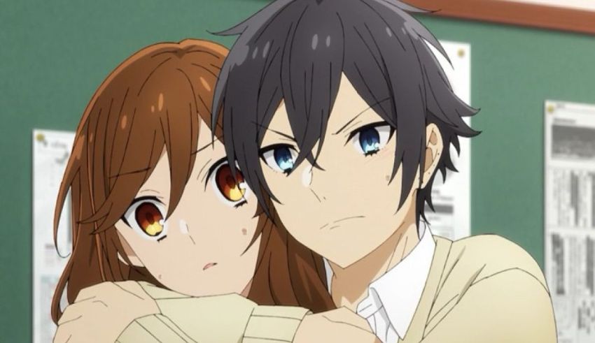 Two anime characters hugging each other in an office.
