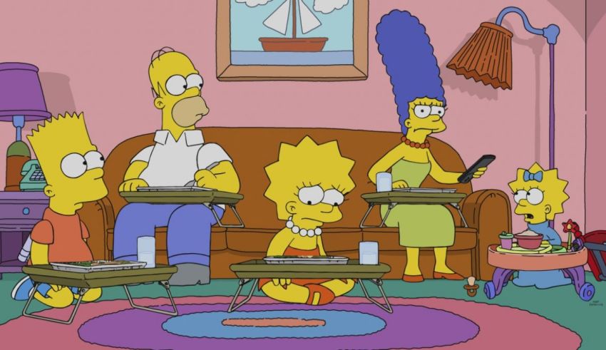 The simpsons family sits on a couch in a living room.