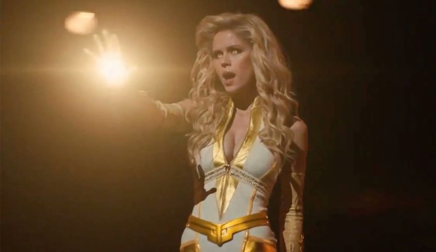 A woman in a golden costume holding a flashlight.