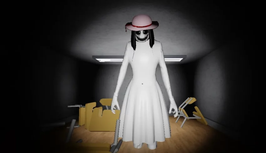 A woman in a white dress is standing in a dark room.