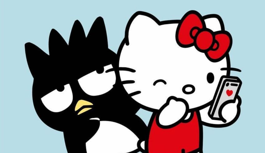 Hello kitty and a penguin holding a cell phone.