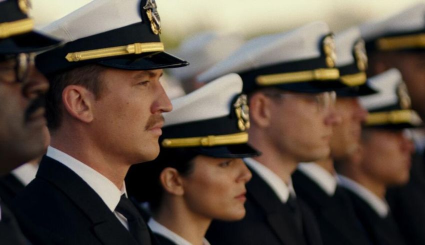 A group of sailors in uniform standing in a line.