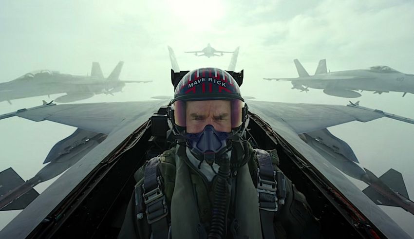 A man sitting in the cockpit of a fighter jet.