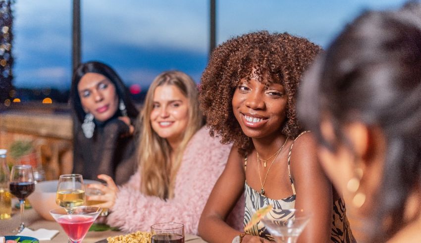 A group of women sitting around a table at a restaurant.