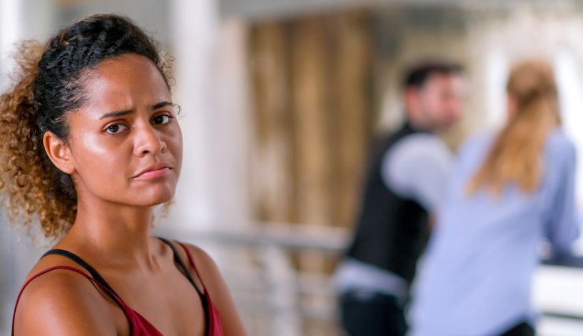 A woman is standing in front of a group of people.