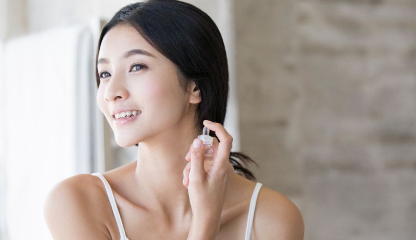 A young asian woman looking at her phone.