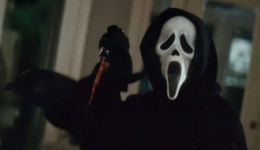 A man in a scream mask holding a knife.