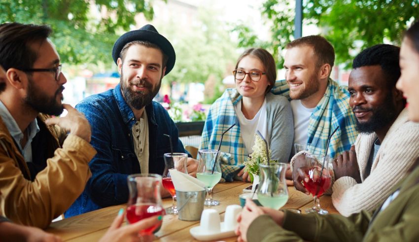 A group of people sitting around a table.