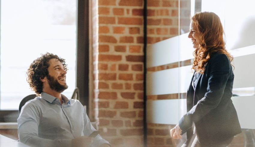 Two business people talking in an office.