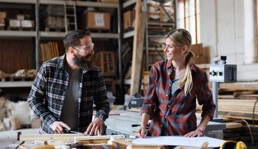 A man and woman working together in a workshop.