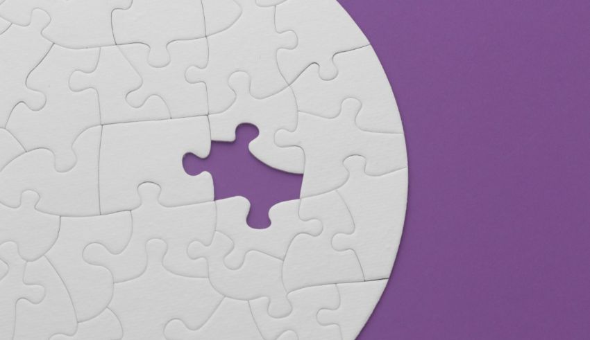 A white jigsaw puzzle with a missing piece on a purple background.