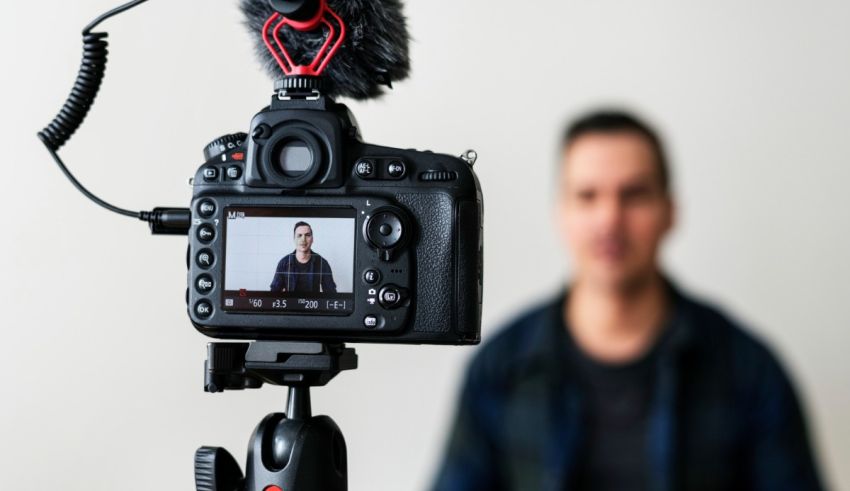 A man is recording a video with a camera.