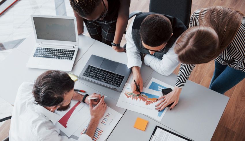 A group of business people working together at a table.