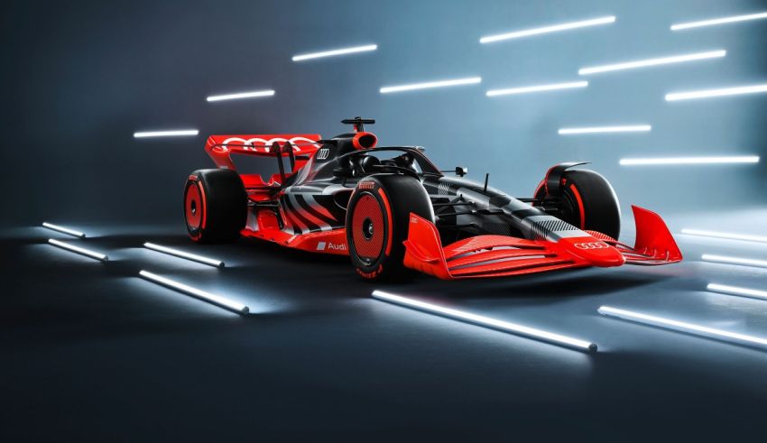 A red and black racing car in a dark room.