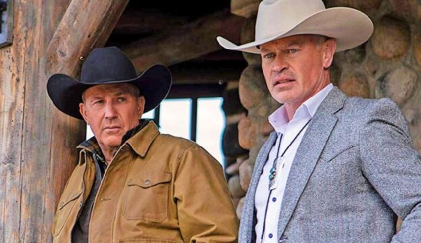 Two men in cowboy hats standing next to each other.