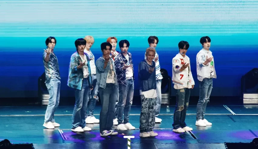 A group of bts members standing on stage.