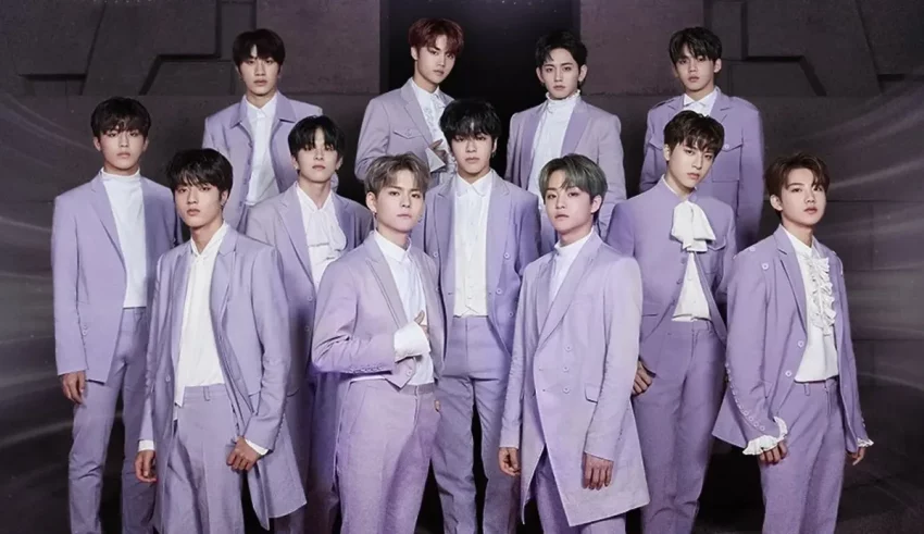 A group of men in purple suits posing for a picture.
