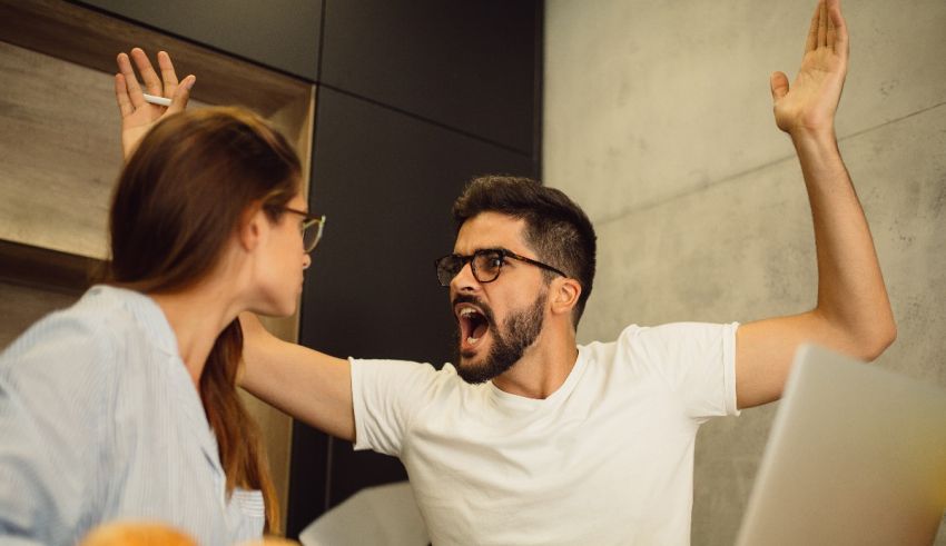 A man and woman yelling at each other in the office.